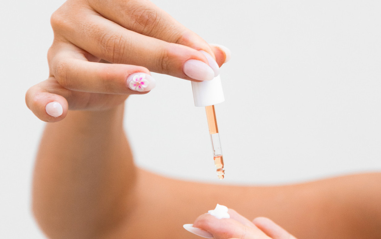Botanical Antioxidants skincare active concentrate being mixed into a personalized cream